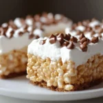 Rice krispie treats with marshmallow fluff displayed on a plate.